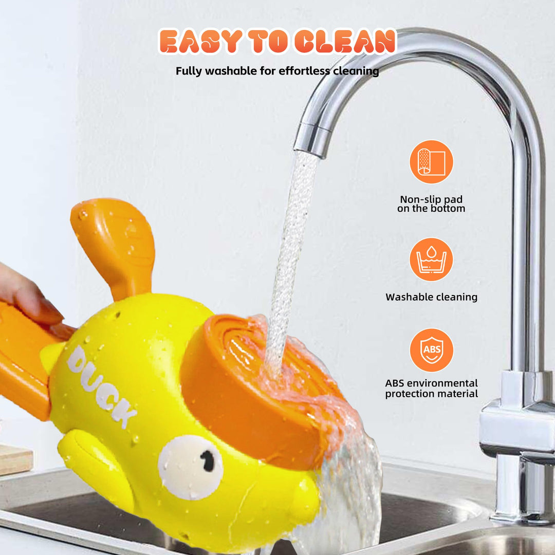 Yellow and orange duck-shaped water sprayer being rinsed under a faucet with text indicating it is easy to clean.
