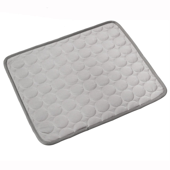 Gray bath mat with textured surface on a white background