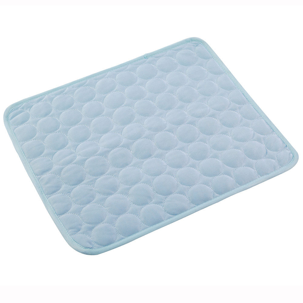 Light blue quilted bath mat on a white background