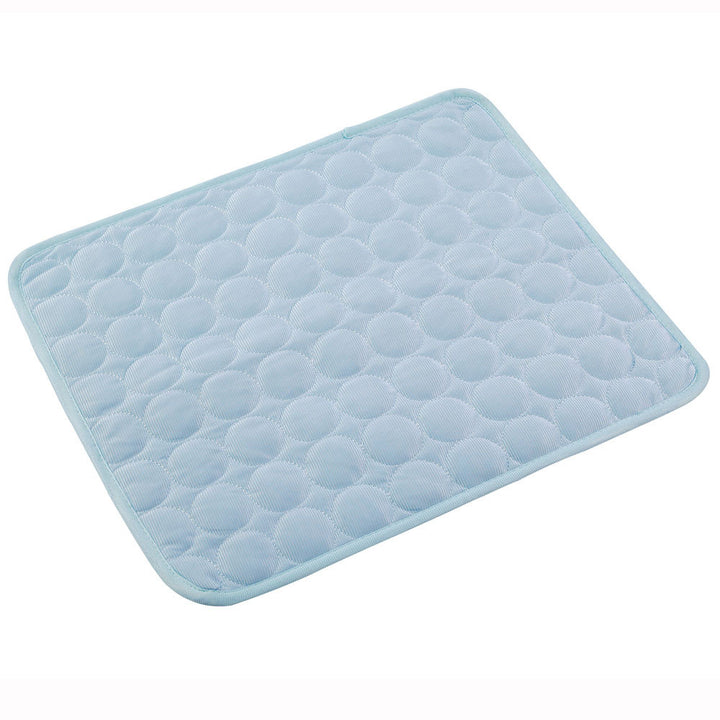 Light blue quilted bath mat on a white background